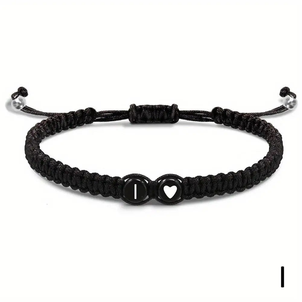 Black braided bracelet with a heart and letter &