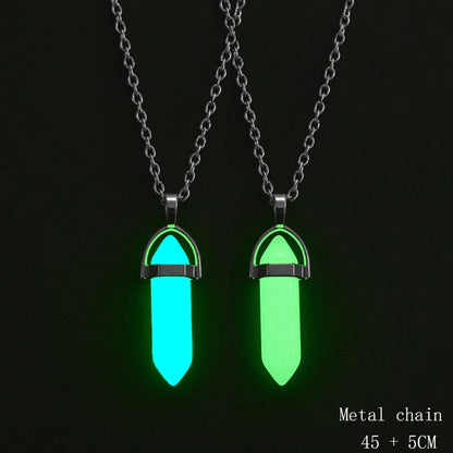 Two glowing necklaces with metal chains on a black background