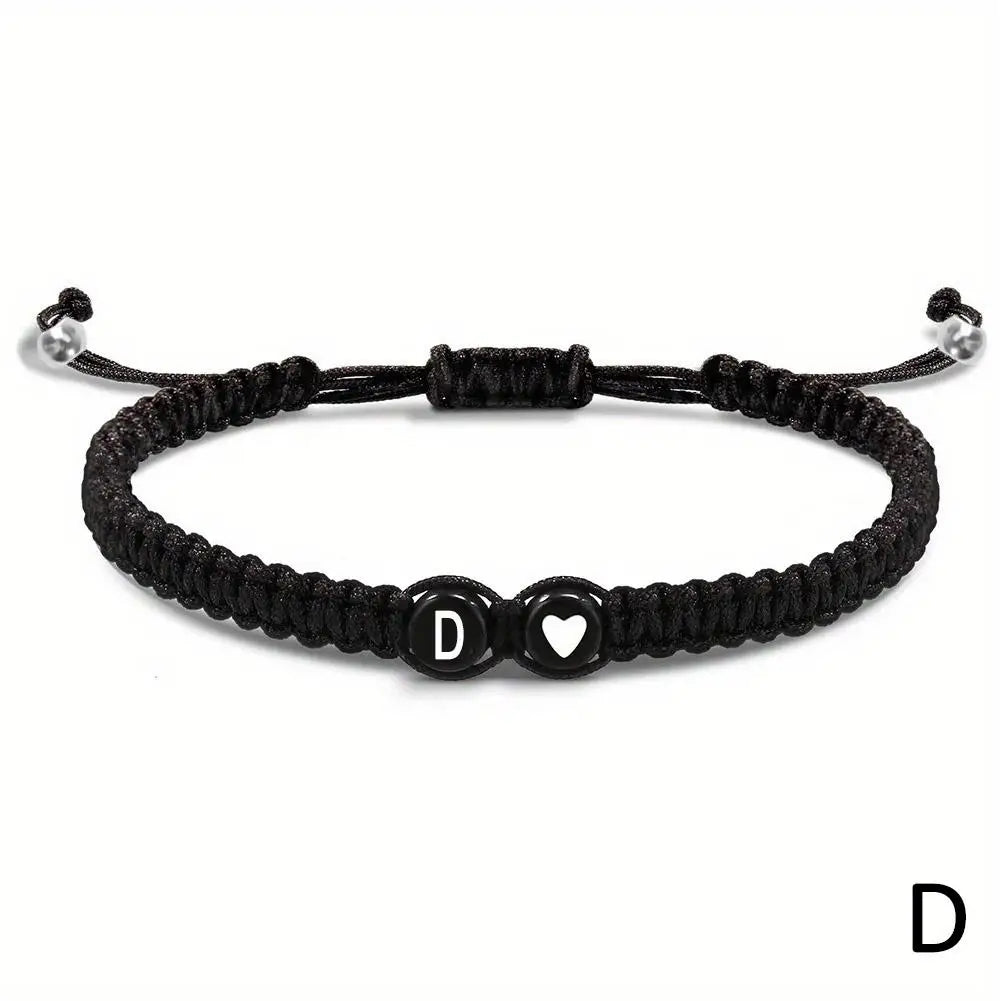 Black braided bracelet with letter &