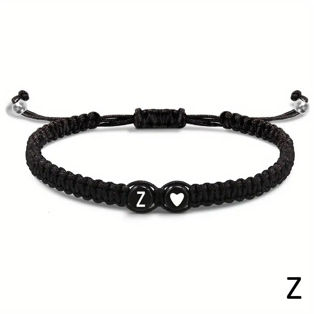 Black braided bracelet with letter &