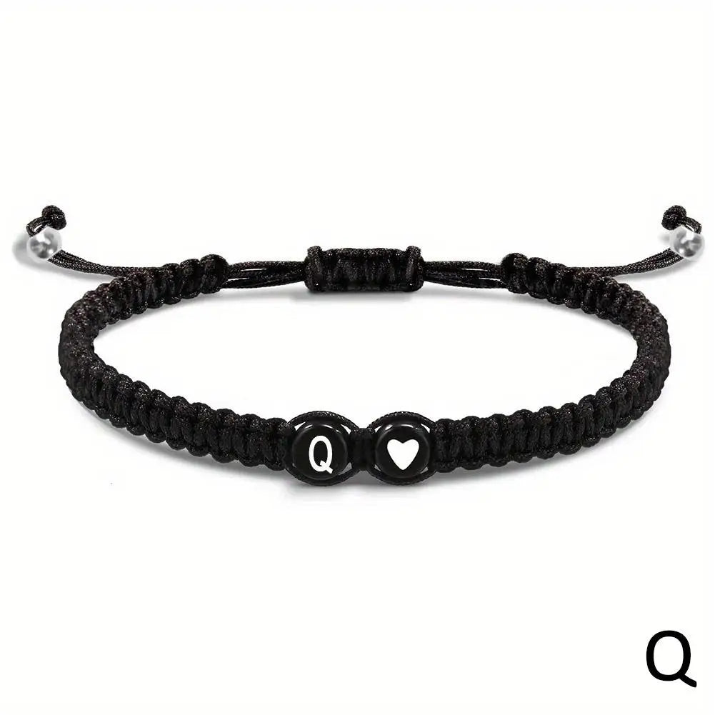 Black braided bracelet with letter &
