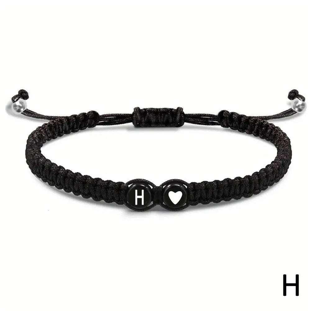 Black braided bracelet with letter &