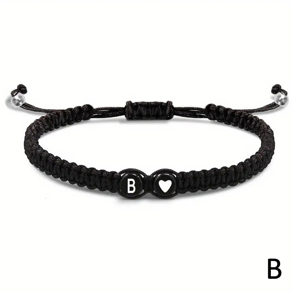 Black braided bracelet with letter &