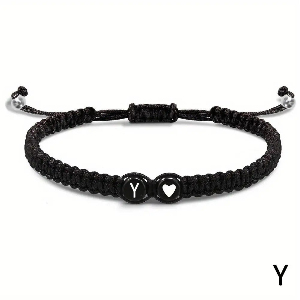 Black braided bracelet with letter &