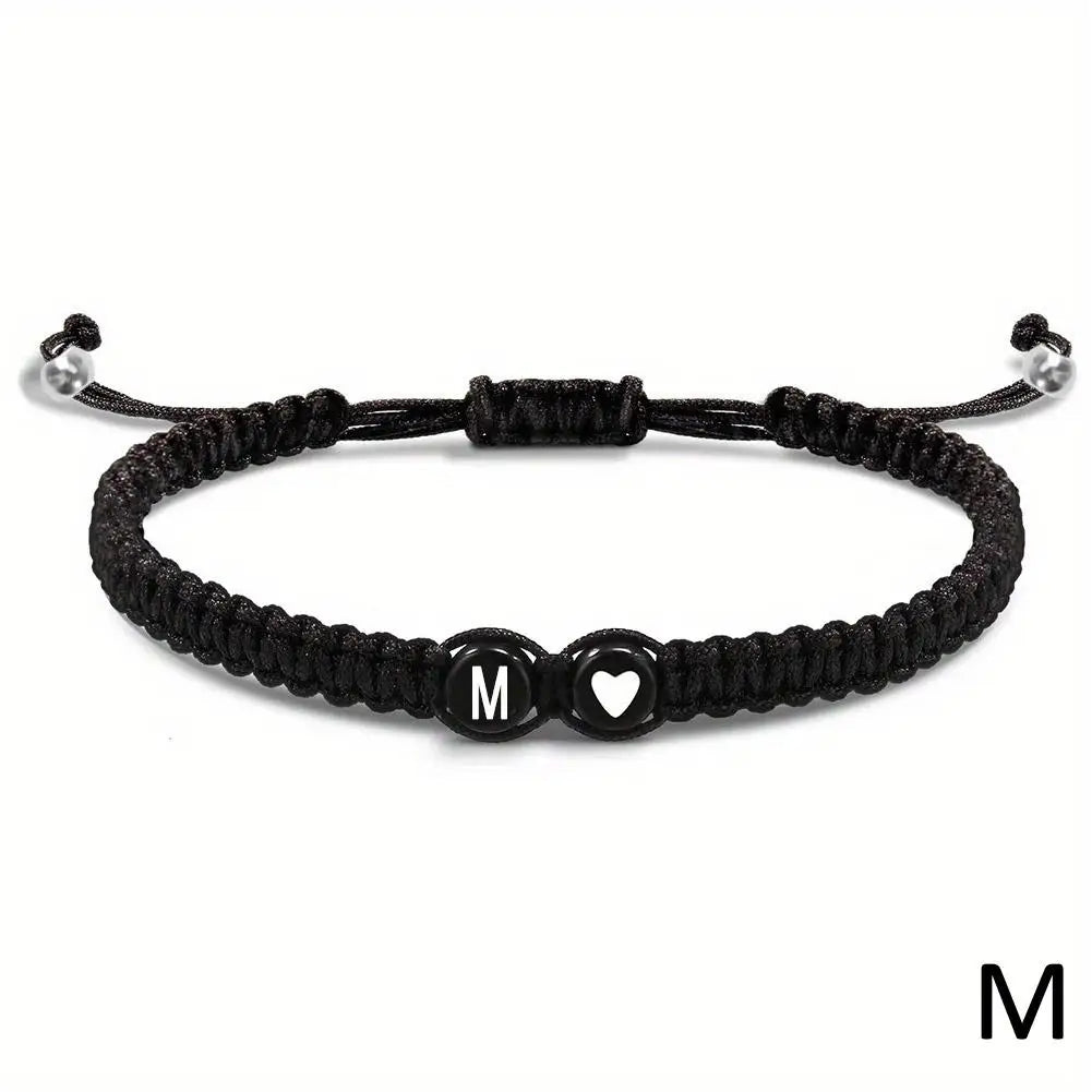 Black braided bracelet with letter &